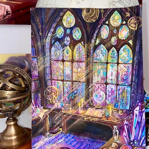 May include: An illustration of a mystical study with stained glass windows. The artwork features a desk with books, crystals, and a dragon, illuminated by soft light. The color palette includes purples, blues, and yellows.