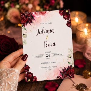 Puede incluir: Una tarjeta rectangular de save the date con detalles florales en acuarela de color rojo oscuro y rosa en las esquinas. El texto dice: SAVE THE DATE, Juliana & Rosa, THURSDAY AUGUST 24 2027 AT 10:00 AM, AT BORCELLE HOTEL, 123 Anywhere St., Any City, ST 12345.