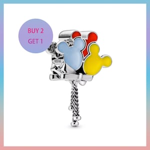 May include: A silver charm with three Mickey Mouse head-shaped balloons in red, blue, and yellow. The charm has a chain and the text "BUY 2 GET 1". The charm is marked with "PANDORA" and "S925 ALE".