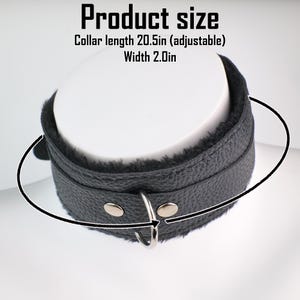 May include: Black leather collar with a soft, plush interior. The collar has a metal ring and adjustable length of 20.5 inches. The width of the collar is 2.0 inches. The text "Product size" is at the top of the image.