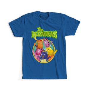 May include: A blue t-shirt featuring the Backyardigans cartoon characters. The shirt has a graphic of the Backyardigans characters in a circle with the show's logo in green and yellow.