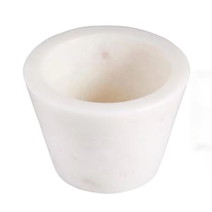 May include: A white marble mortar with a slightly tapered cylindrical shape. The mortar has a wide, open mouth and a smooth, polished surface. The interior is a lighter shade of white.