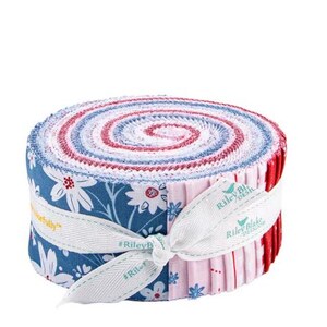 May include: A rolled bundle of fabric strips in shades of blue, red, and white, tied with a ribbon. The fabric features floral and patterned designs. The ribbon is white with the text "Riley Blake Designs".