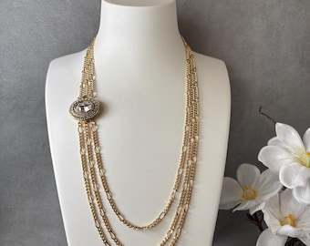 swar003-Three gold plated chains in varying lengths, 20” 22” and 24”, with 23k gold plated clasp with Swarovski crystals