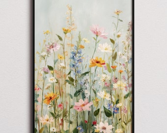 May include: A framed floral print featuring a field of wildflowers in shades of yellow, pink, blue, and white. The artwork has a soft, painterly style with a light blue background. The black frame adds a classic touch to the botanical art.
