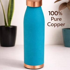 May include: A turquoise water bottle with a copper lid and base. The bottle has the text "100% Pure Copper" and the brand name "Zovicopt". The bottle is cylindrical and appears to be made of metal.
