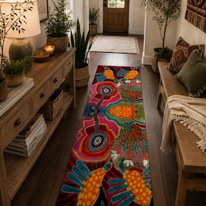 May include: A colorful, patterned runner rug with a vibrant design featuring abstract birds, flowers, and musical instrument shapes. The rug's primary colors are red, pink, blue, and orange, adding a bold statement to the hallway.