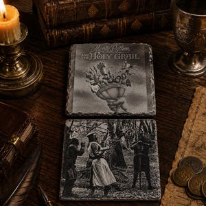 May include: Two square slate coasters featuring monochromatic imagery. The top coaster displays the text Monty Python and the Holy Grail above a hand holding a chalice with figures. The bottom coaster depicts a scene with three armored figures.
