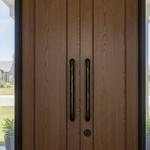 May include: A pair of wooden doors with a natural wood grain finish. The doors have long, dark metal handles and a round lock. The doors are framed by black trim and flanked by windows, offering a view of the outdoors.