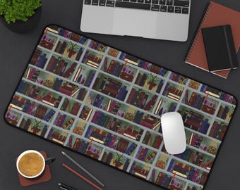 May include: A rectangular desk mouse mat with a repeating pattern of bookshelves filled with books, plants, and decorative items. The mat has a black border and a white computer mouse is on the mat.