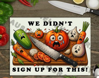 May include: A rectangular cutting board with a humorous illustration of distressed vegetables and the text "WE DIDN'T SIGN UP FOR THIS!". A large knife rests on the board, surrounded by cartoon tomatoes, carrots, onions, and a cucumber.