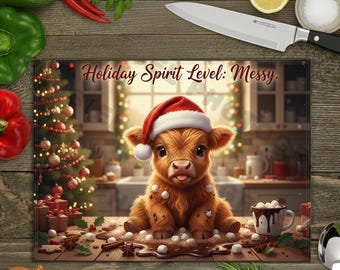 May include: A rectangular cutting board with the text "Holiday Spirit Level: Messy" features a cartoon calf wearing a Santa hat. The calf is surrounded by marshmallows, chocolate, and Christmas decorations. A knife, vegetables, and spices are in the background.
