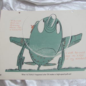 May include: A vintage cartoon illustration of a teal and grey airplane with text. The plane has large eyes and a long nose. Text includes "I wish he could see an X-RAY of my insides!" and "What ACTUALLY happened after Dil makes a high-speed pull-out!"