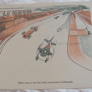 May include: A black and white cartoon illustration of a plane flying over a race track. The plane has a pilot in the cockpit and the text "Gosh, I'm versatile!" is written on the side. The caption below the image reads "Dilbert taxies so fast they finally entered him at Indianapolis."