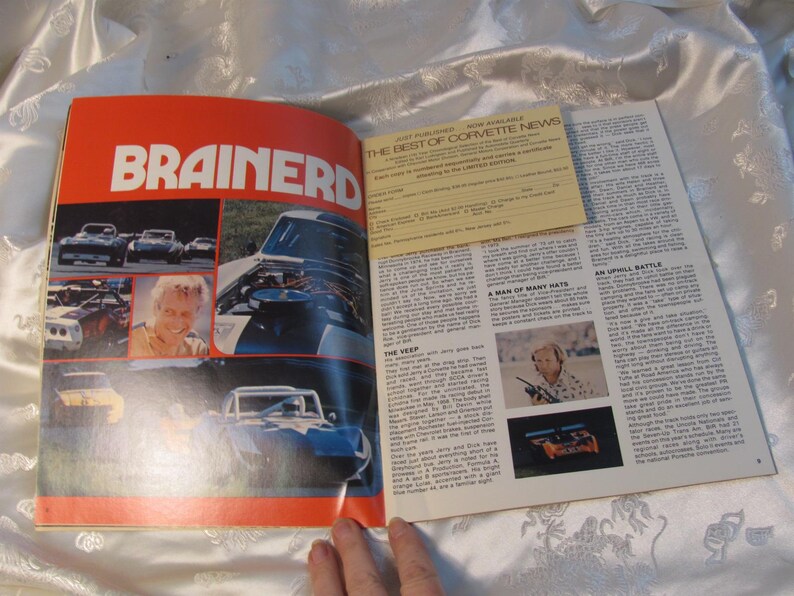 May include: Open magazine pages featuring the word "BRAINERD" in large orange text. The left page displays car images and a portrait. The right page has text and a yellow insert titled "BEST OF CORVETTE NEWS".