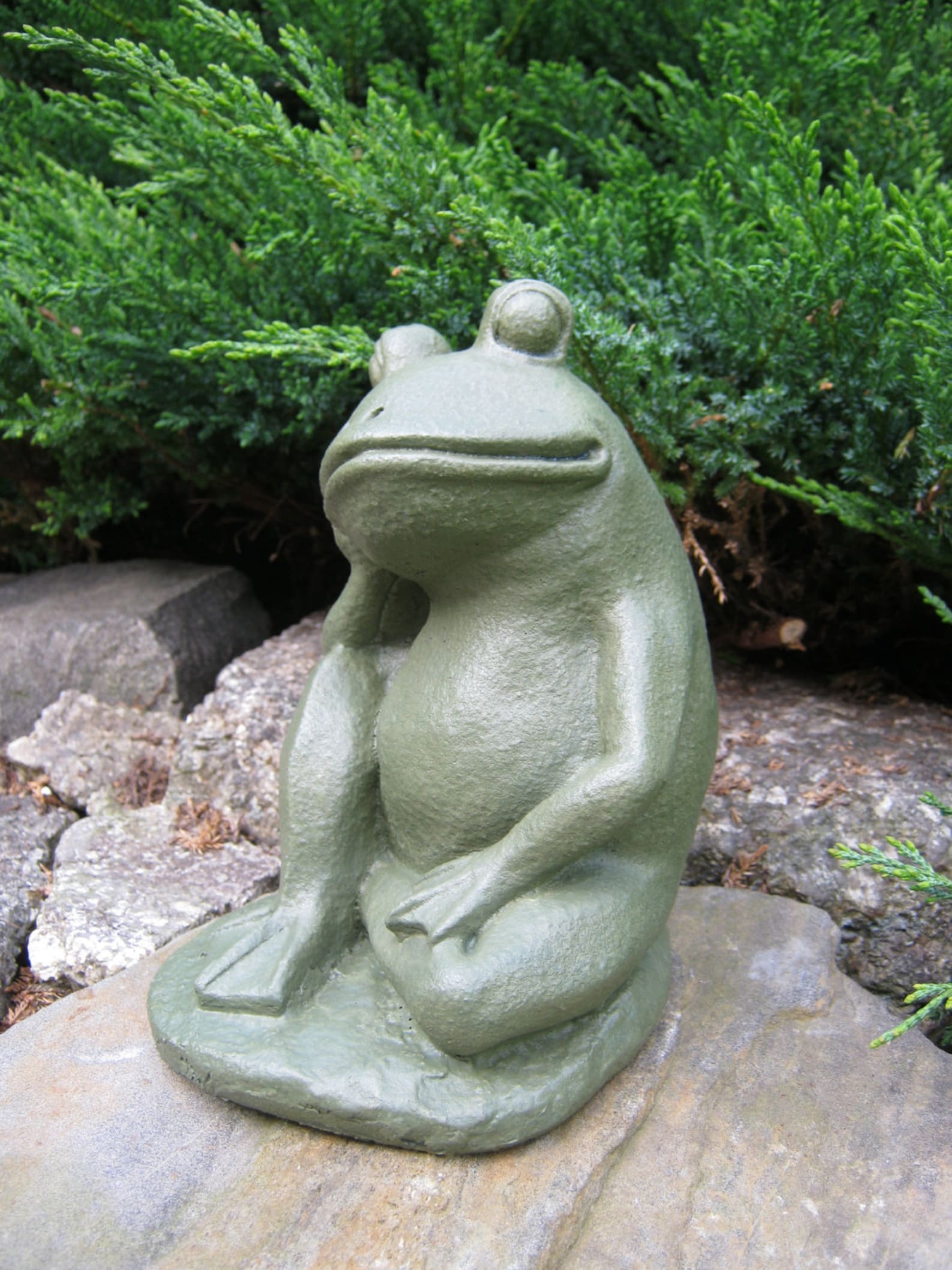 relaxing frog statue