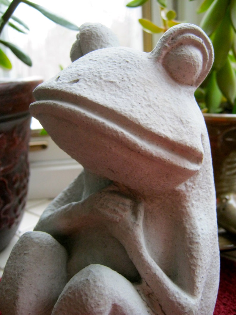 concrete frog statue