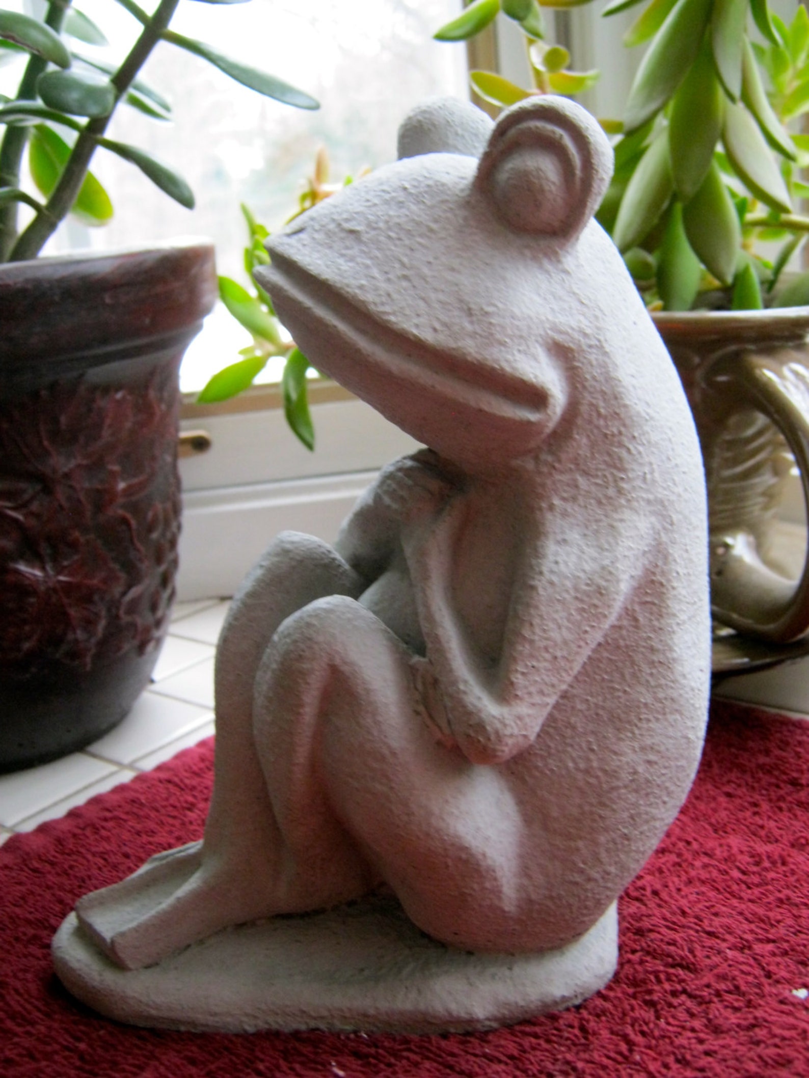 concrete frog statue