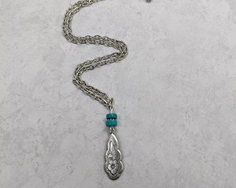 Turquoise Heishi Bead Necklace: Antiqued Silver Floral Charm