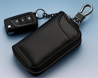 May include: Black leather key case with a zipper closure and a silver-tone clasp. A black car key with three buttons is attached to the case with a chain. The key case is designed to protect car keys.