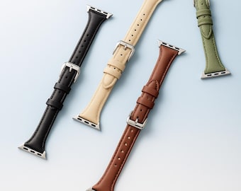 May include: Four leather watch bands in black, cream, brown, and olive green. Each band has a silver buckle and a series of holes for adjustment. The bands are designed to fit a smartwatch and are displayed on a light blue background.