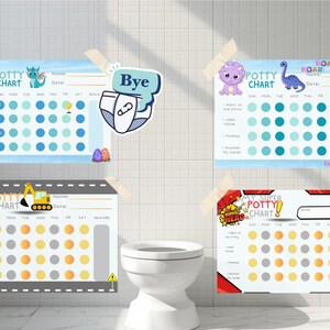Peut inclure: Quatre tableaux d'apprentissage de la propreté colorés sont collés sur un mur carrelé blanc au-dessus des toilettes. Chaque tableau présente un thème différent, notamment des dinosaures, des véhicules de chantier et un super-héros. Les tableaux sont conçus pour suivre les progrès.