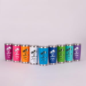May include: A collection of personalized travel tumblers in various colors, each featuring a palm tree design and the text "PUNTA CANA" along with a name and the year 2025. The tumblers have a silver lid.