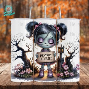 May include: Three white stainless steel tumblers with a spooky Halloween design. Each tumbler features a cartoon zombie girl holding a sign that reads "MENTALLY DECEASED". The design includes bare trees, flowers, and a small lantern.