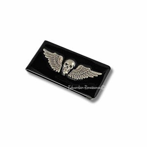 Clip para billetes con forma de calavera con alas incrustadas en esmalte negro pintado a mano, estilo steampunk, de inspiración gótica, colores personalizados y opciones personalizadas