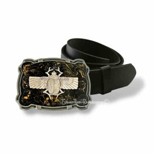 May include: Black leather belt with a silver-colored buckle featuring a scarab beetle design. The buckle has a black background with gold swirls and the text "Edwardian Renaissance".