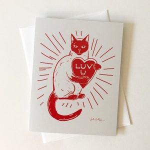 De Kaart van de groet met Het houden van de kat Hart