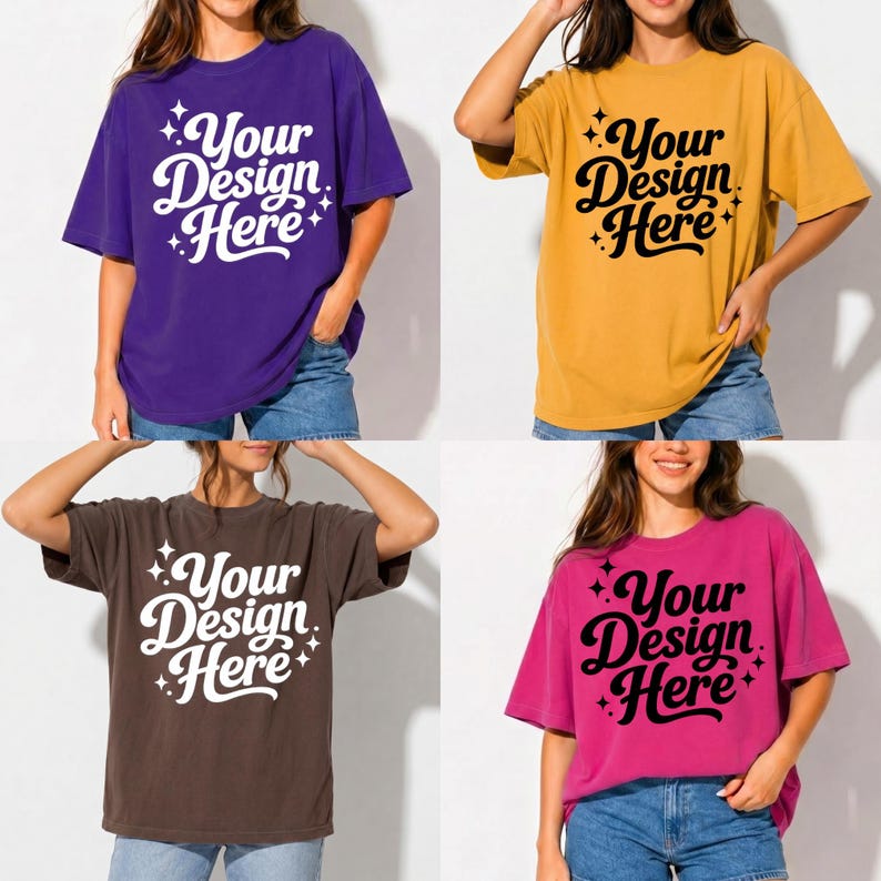 May include: Four oversized t-shirts in purple, gold, brown, and pink. Each shirt features the text "Your Design Here" in a stylized font. The shirts are worn with denim shorts, showcasing a casual, relaxed style.