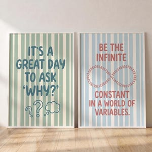 May include: Two rectangular wall art prints with vertical stripes. The left print has a sage green and white striped background with dark blue text reading IT'S A GREAT DAY TO ASK 'WHY?' and three question mark icons. The right print has a light blue and white striped background with red text reading BE THE INFINITE CONSTANT IN A WORLD OF VARIABLES and an infinity symbol formed by numbers.