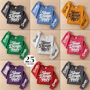 May include: A collection of sweatshirts in various colors, including gray, blue, yellow, green, white, pink, purple, red, and dark gray. Each sweatshirt features the text "Your Design Here" on the front and "Design" on the sleeves.