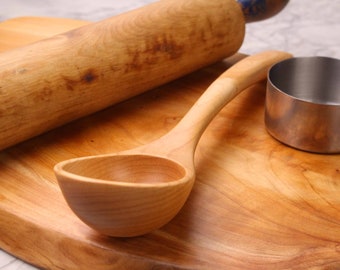 This is a handmade treenware wooden serving spoon carved from Sugar Maple wood