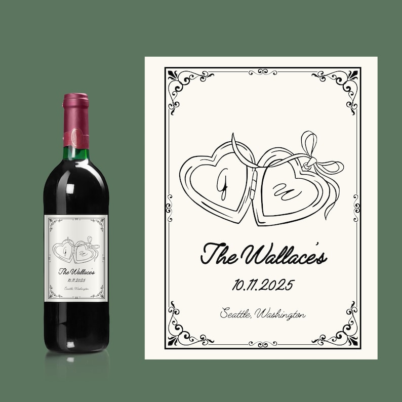 May include: A bottle of red wine with a custom label featuring two interlocking heart-shaped lockets. The label includes the names "The Wallace's", the date 10.11.2025, and the city "Seattle, Washington".