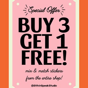 May include: A pink rectangular sign with an orange border displays a special offer: "BUY 3 GET 1 FREE!" in bold black letters. The text "mix & match stickers from the entire shop!" and the shop's handle, "@StitchSpeakStudio," are also included.