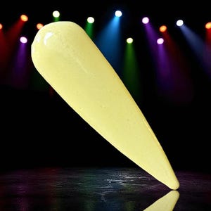 May include: A single, elongated, pale yellow object with a smooth, glossy surface. The object tapers from a rounded top to a pointed tip. The background is black with colorful spotlights.