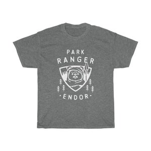 May include: Gray t-shirt with a white graphic of a character from Star Wars, a forest, and the text "Park Ranger Endor".