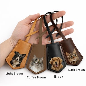 May include: Leather luggage tags in light brown, coffee brown, black, and dark brown. Each tag features a pet portrait: a border collie, a cat, a golden retriever, and a tabby cat. The tags have a loop for attachment.