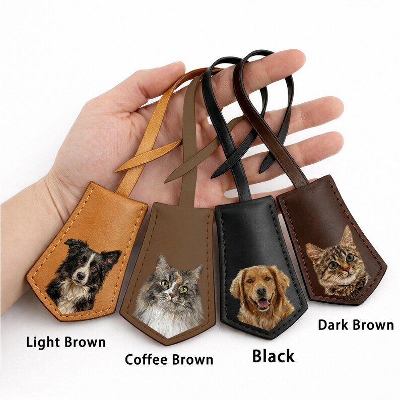 May include: Leather luggage tags in light brown, coffee brown, black, and dark brown. Each tag features a pet portrait: a border collie, a cat, a golden retriever, and a tabby cat. The tags have a loop for attachment.