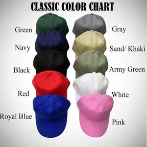 May include: A color chart displays baseball caps in various colors, including green, navy, black, red, royal blue, gray, sand/khaki, army green, white, and pink. The text "CLASSIC COLOR CHART" is at the top.