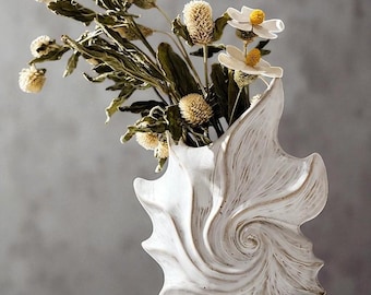 Jarrón de cerámica con forma de caracol: cerámica minimalista moderna para decorar el salón y las estanterías.