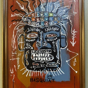 May include: Framed artwork featuring a stylized face with a black head and white teeth. The artwork includes the text "FEDERAL RESERVE VALUE" and "NICOTINE" and the artist's signature "BASQUIAT". The background is a mix of orange, blue, and white.