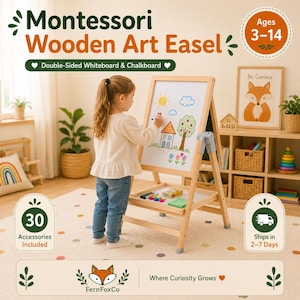 May include: A light-colored wooden art easel featuring a double-sided design with a white whiteboard and a chalkboard. The easel includes a storage tray for art supplies and is intended for children ages 3-14. The whiteboard displays a colorful drawing.