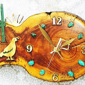 May include: A rustic wooden clock with a natural edge. The clock face is adorned with gold numerals, turquoise stones, and gold clock hands. A green cactus and a yellow bird are on the left side. The clock measures approximately 12 inches in diameter.
