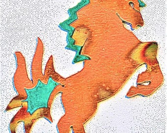 May include: Orange wooden horse silhouette with a teal green mane and tail. The horse is standing on its hind legs with its front legs raised in the air.