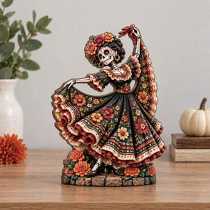 May include: A decorative figurine of a skeleton dancer wearing a black dress adorned with colorful floral patterns and ruffled edges. The figure features a skull face with intricate markings, a floral headpiece, and stands on a stone-like base.