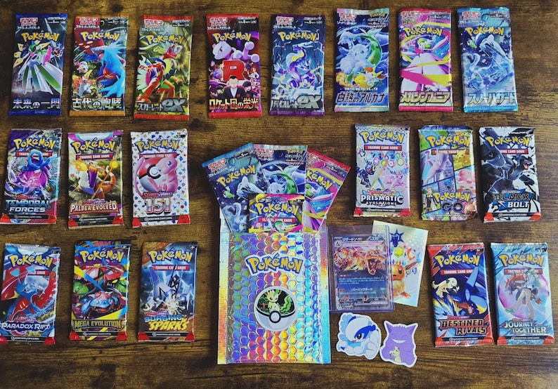 May include: A selection of Pokémon trading card packs and accessories, including booster packs, a holographic sleeve, and stickers. The packs display diverse designs and colours, with text such as "Temporal Forces" and "Paradox Rift".