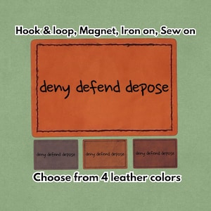 May include: Orange leather patch with the words "deny defend depose" in black script. The patch is available in four leather colors and can be attached with hook & loop, magnet, iron-on, or sewn on.